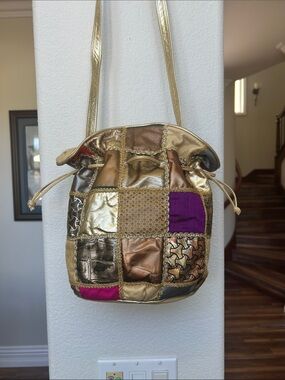 Gino Genuine Leather Gold Patchwork Drawstring Shoulder Bag with Purple Accents